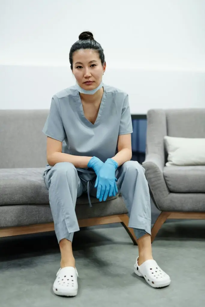 nurse sitting on a couch after a busy day.
